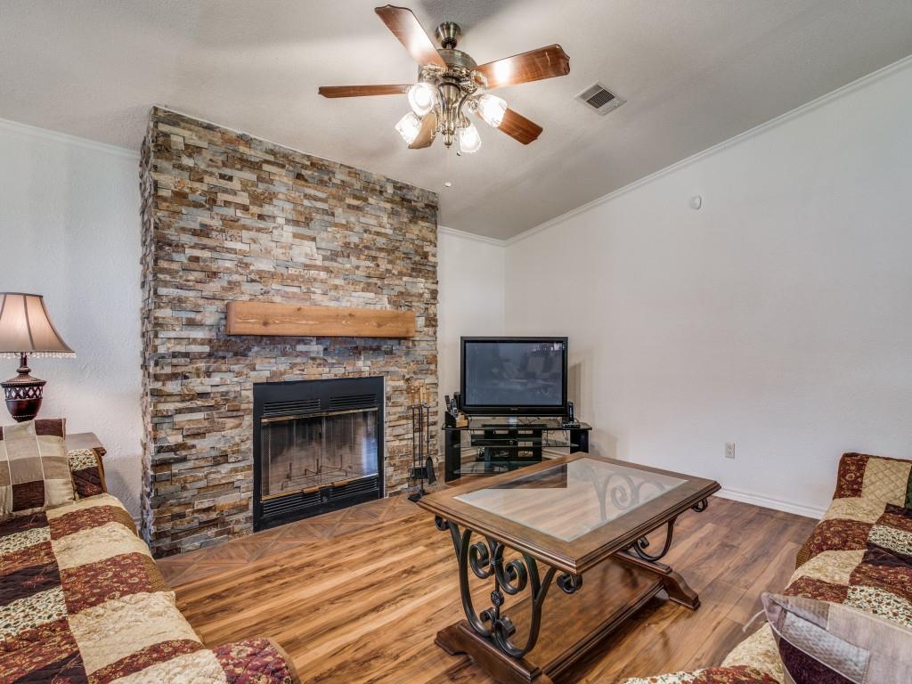 233 Esquire Estates Road Mabank, TX 75156 - Photo 5 of 34 a living room with furniture and a fireplace