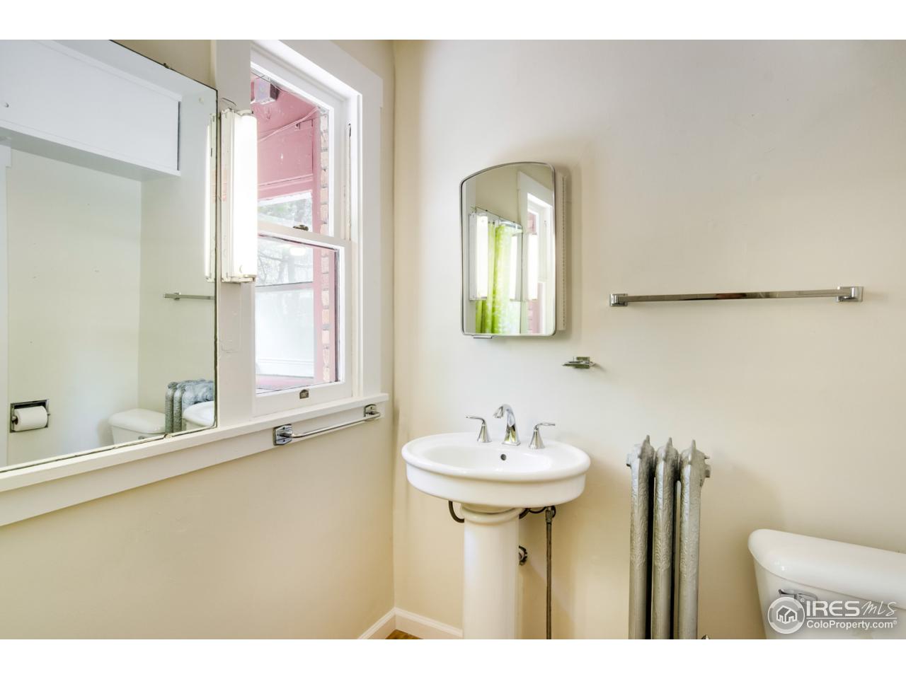 747 12th Street Boulder, CO 80302 - Photo 14 of 25 a bathroom with a sink and a mirror