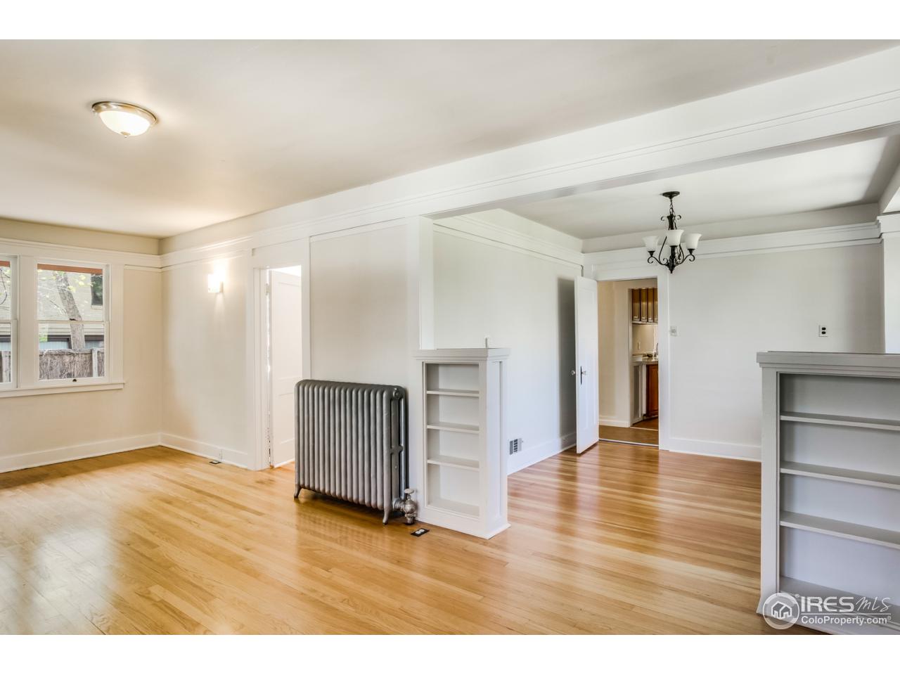 747 12th Street Boulder, CO 80302 - Photo 5 of 25 a view interior of a house with wooden floor a ceiling fan and windows