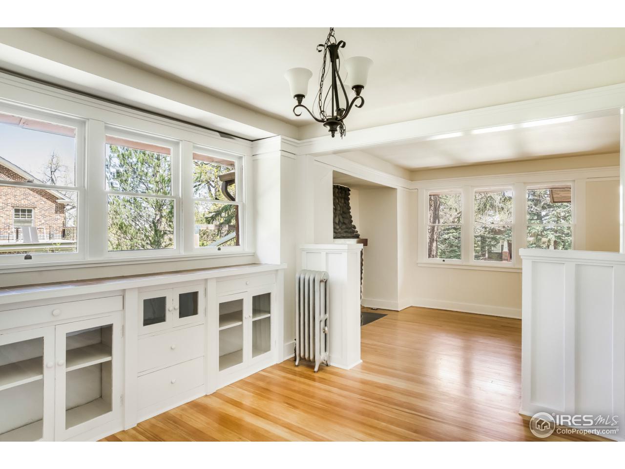 747 12th Street Boulder, CO 80302 - Photo 7 of 25 a view of an empty room with wooden floor and a window