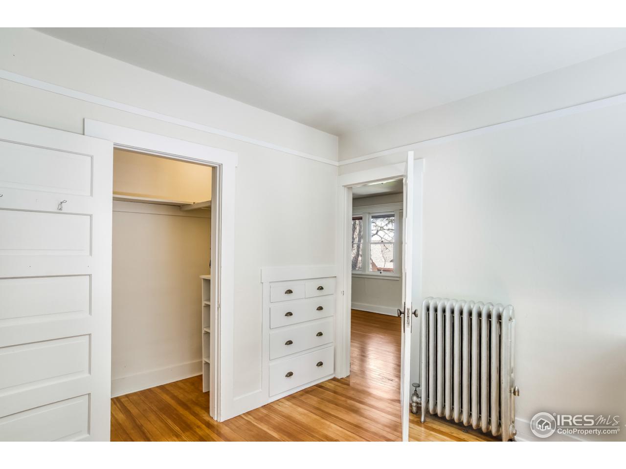 747 12th Street Boulder, CO 80302 - Photo 9 of 25 a view of a bedroom with wooden floor & windows
