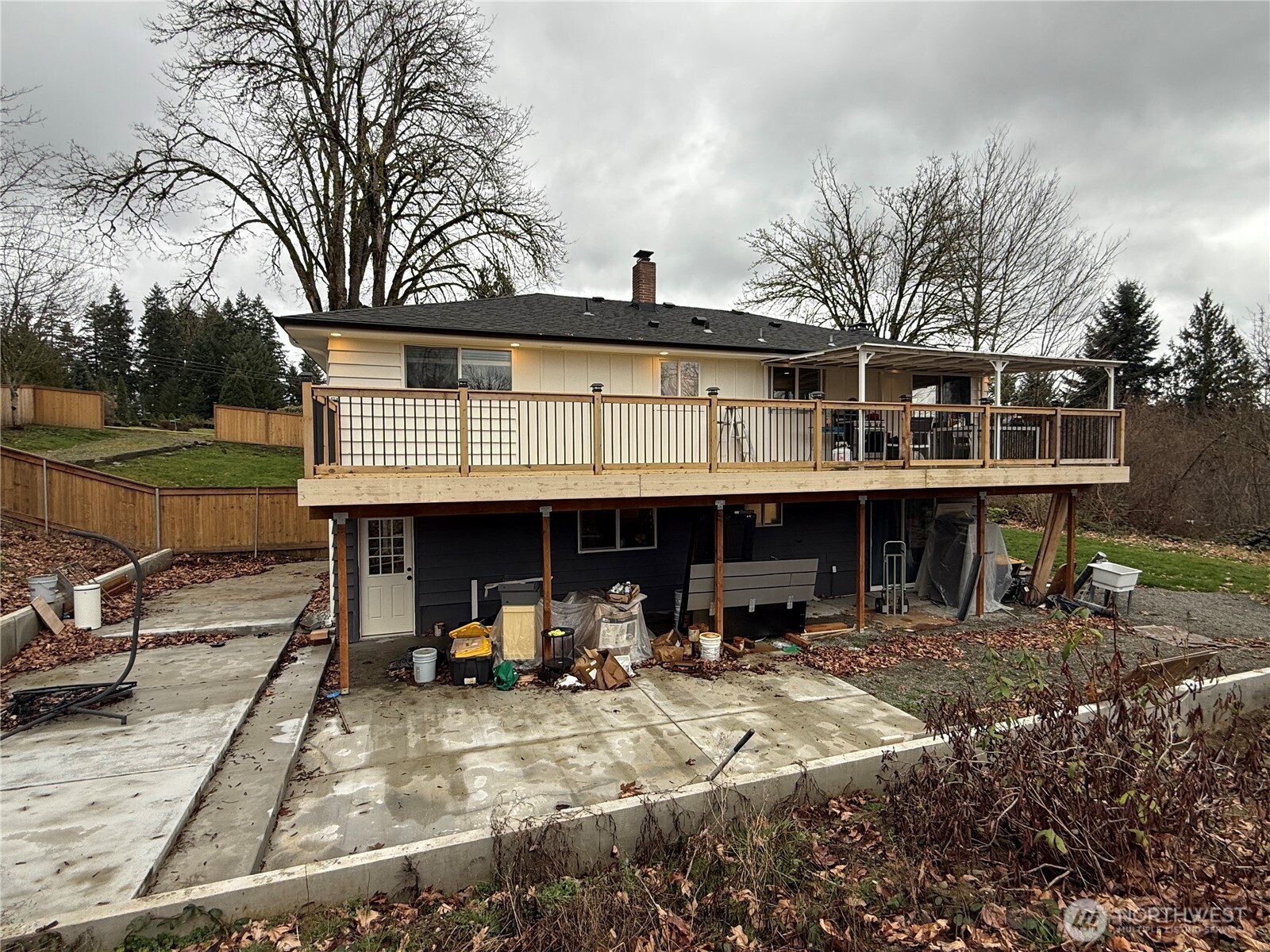 26005 156th Street Southeast Covington, WA 98042 - Photo 23 of 24 a view of a house with backyard porch and sitting area