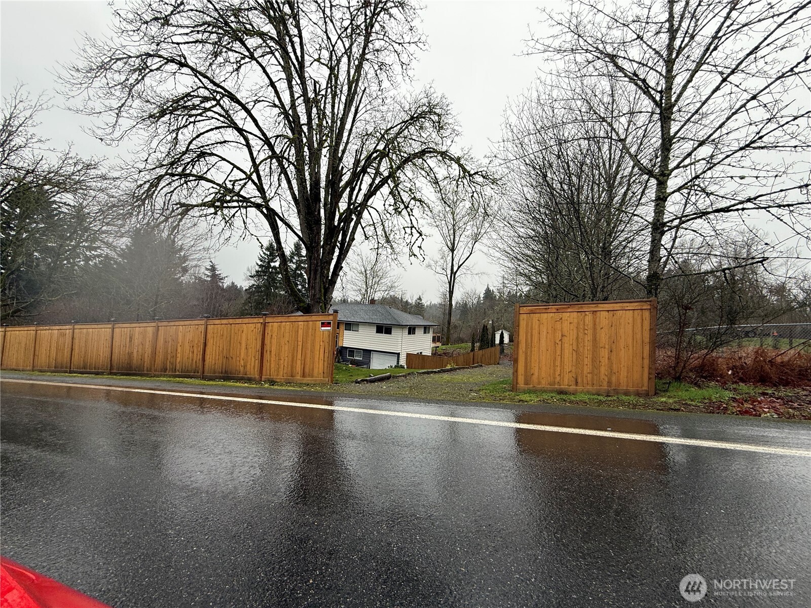 26005 156th Street Southeast Covington, WA 98042 - Photo 5 of 24 a view of a street with a bench and trees