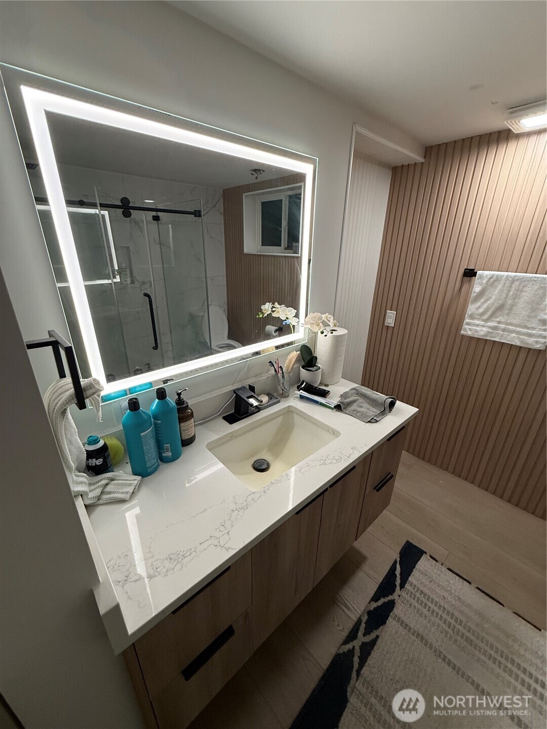 26005 156th Street Southeast Covington, WA 98042 - Photo 10 of 24 a bathroom with a sink a mirror and a toilet