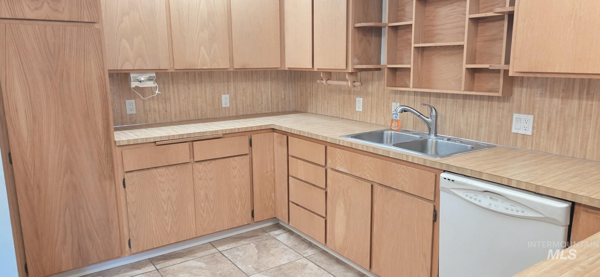 1902 Arlington Street Pomeroy, WA 99347 - Photo 16 of 27 Kitchen featuring dishwasher, light countertops, and light brown cabinetry