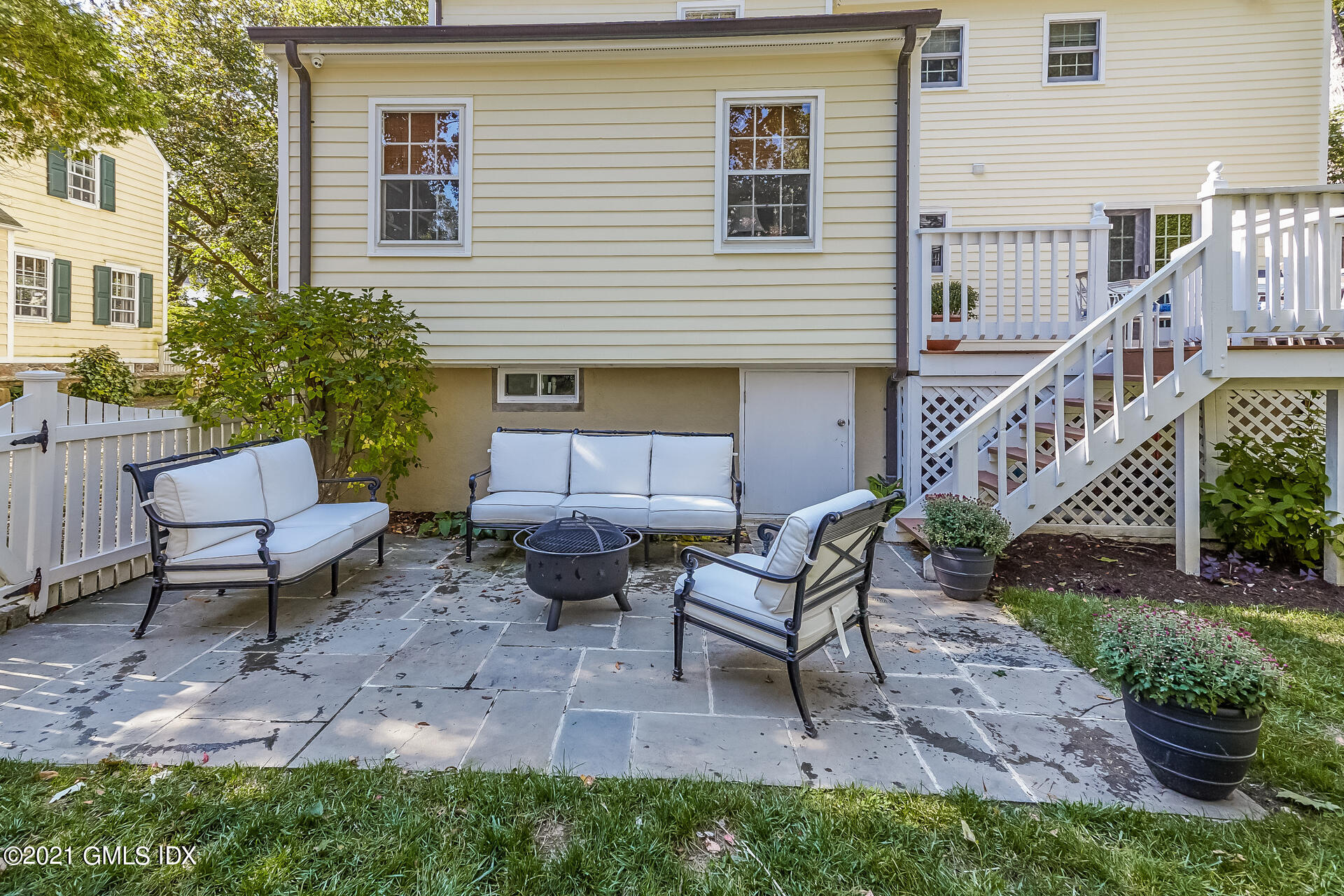 27 Perryridge Road Greenwich, CT 06830 - Photo 20 of 24 a view of a house with backyard and sitting area