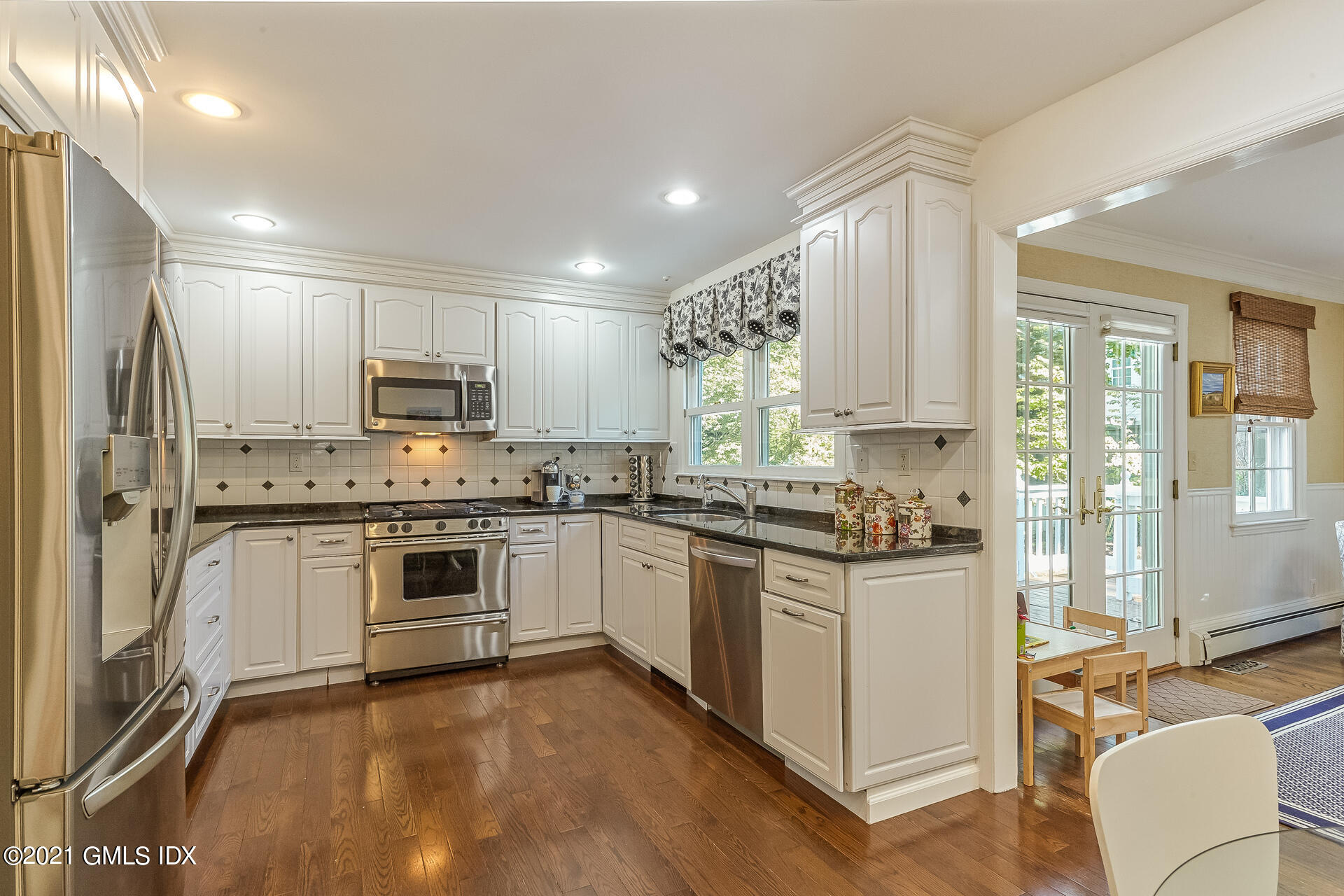 27 Perryridge Road Greenwich, CT 06830 - Photo 6 of 24 a kitchen with a stove a sink and a refrigerator