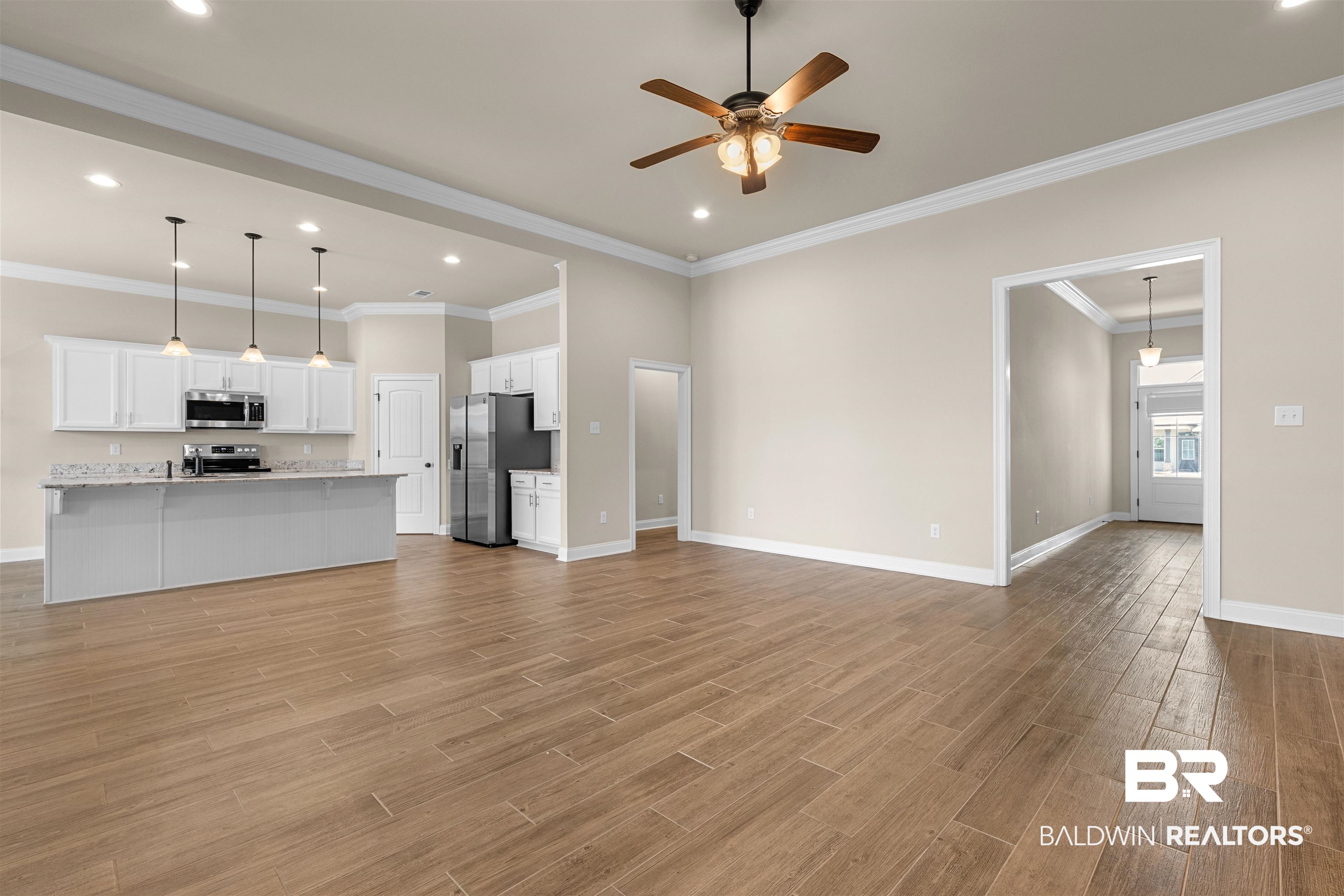 991 Dalton Circle Foley, AL 36535 - Photo 3 of 35 Unfurnished living room with ceiling fan, light wood-style floors, ornamental molding, and recessed lighting