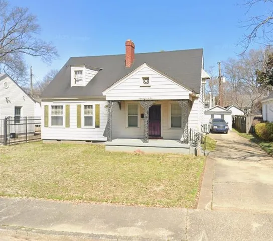 a view of a house with swimming pool and a porch