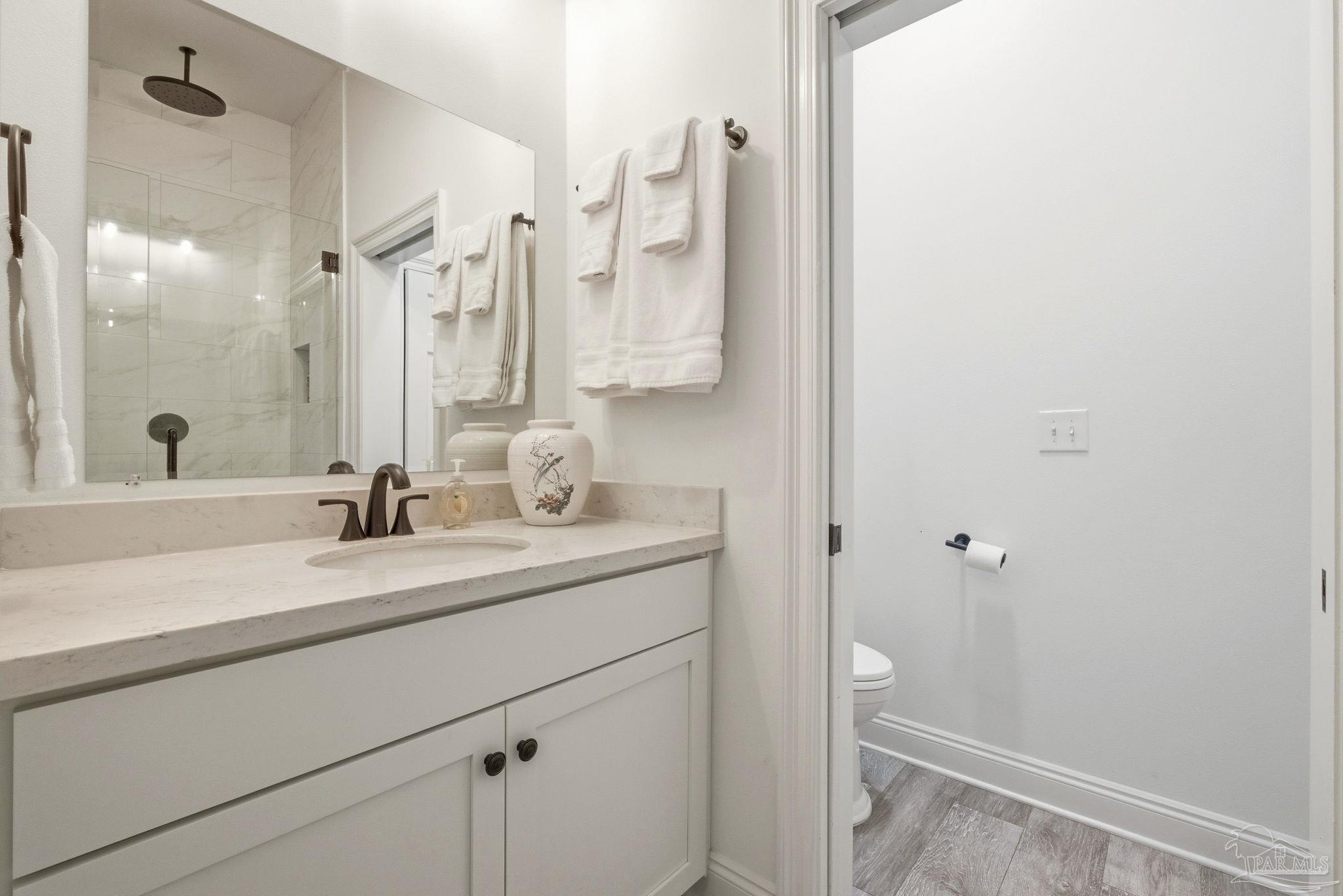 714 East La Rua Street Pensacola, FL 32501 - Photo 52 of 63 a bathroom with a sink and a mirror