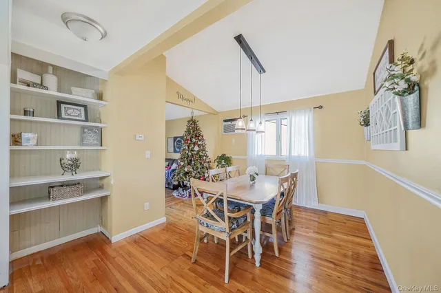 a kitchen with stainless steel appliances granite countertop a stove and white cabinets