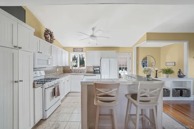 a view of kitchen island kitchen island dining table and chairs