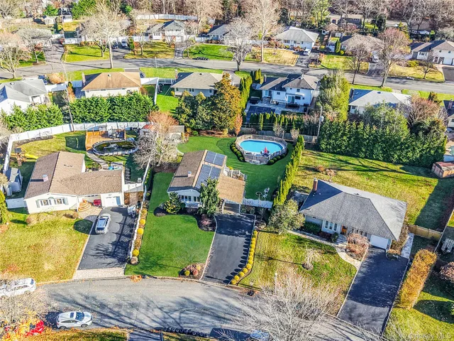 a view of swimming pool with outdoor seating and yard