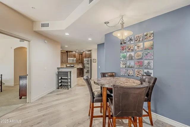 a dining room with furniture and window