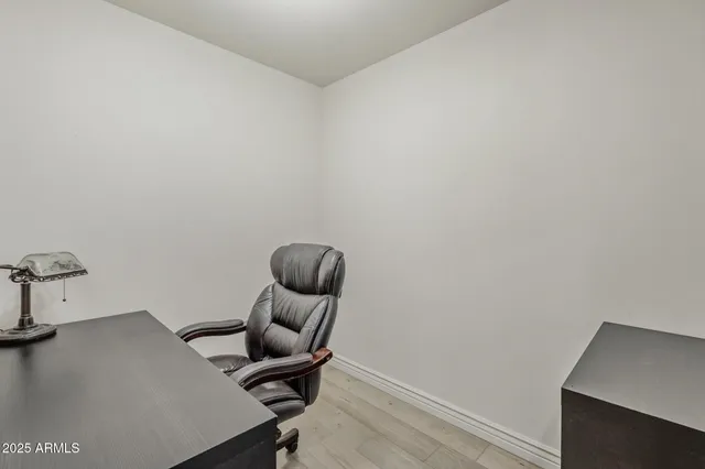 a view of workspace with wooden floor