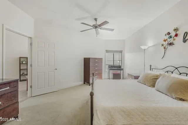 a bedroom with a bed and cabinets