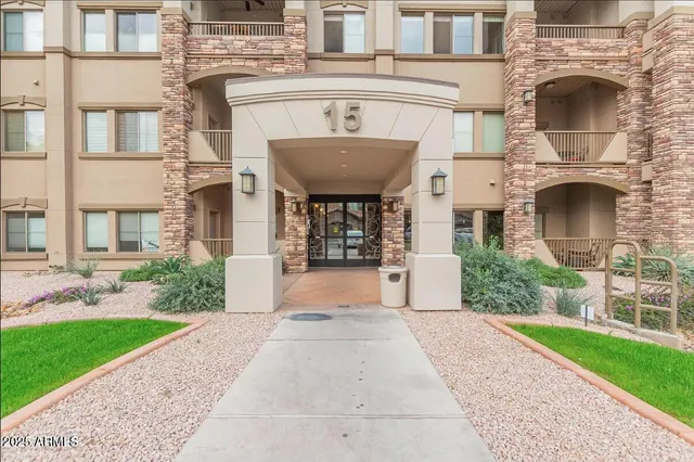 a front view of a building with garden