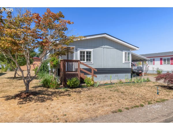 310 Pitney Lane, Unit 40 Junction City, OR 97448 - Photo 1 of 36 a view of a house with a yard