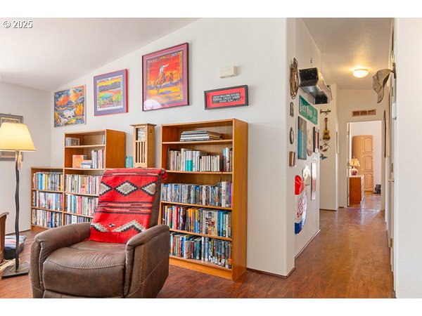310 Pitney Lane, Unit 40 Junction City, OR 97448 - Photo 17 of 36 a living room with furniture and a book shelf