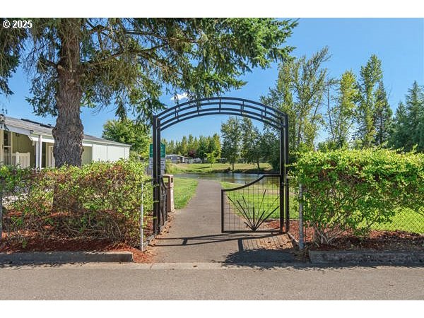 310 Pitney Lane, Unit 40 Junction City, OR 97448 - Photo 34 of 36 a view of a bench in front of a yard