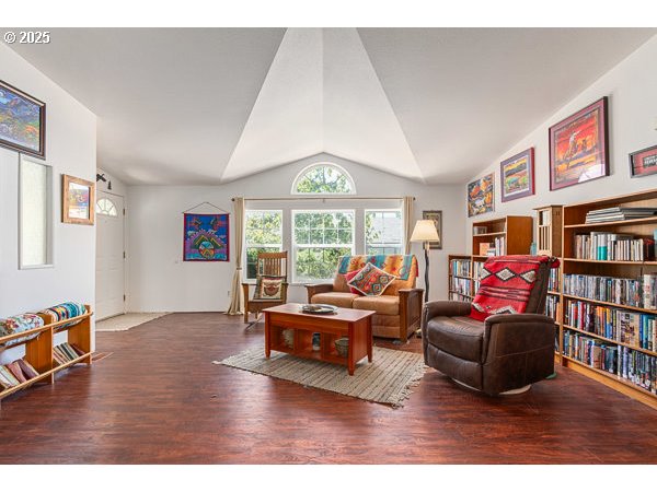 310 Pitney Lane, Unit 40 Junction City, OR 97448 - Photo 5 of 36 a living room with furniture window and book shelf
