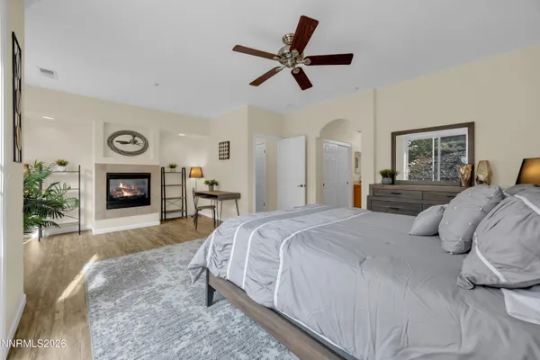 a bedroom with a bed and a fireplace