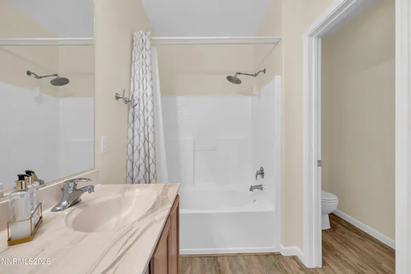 a bathroom with a sink a mirror and a bathtub