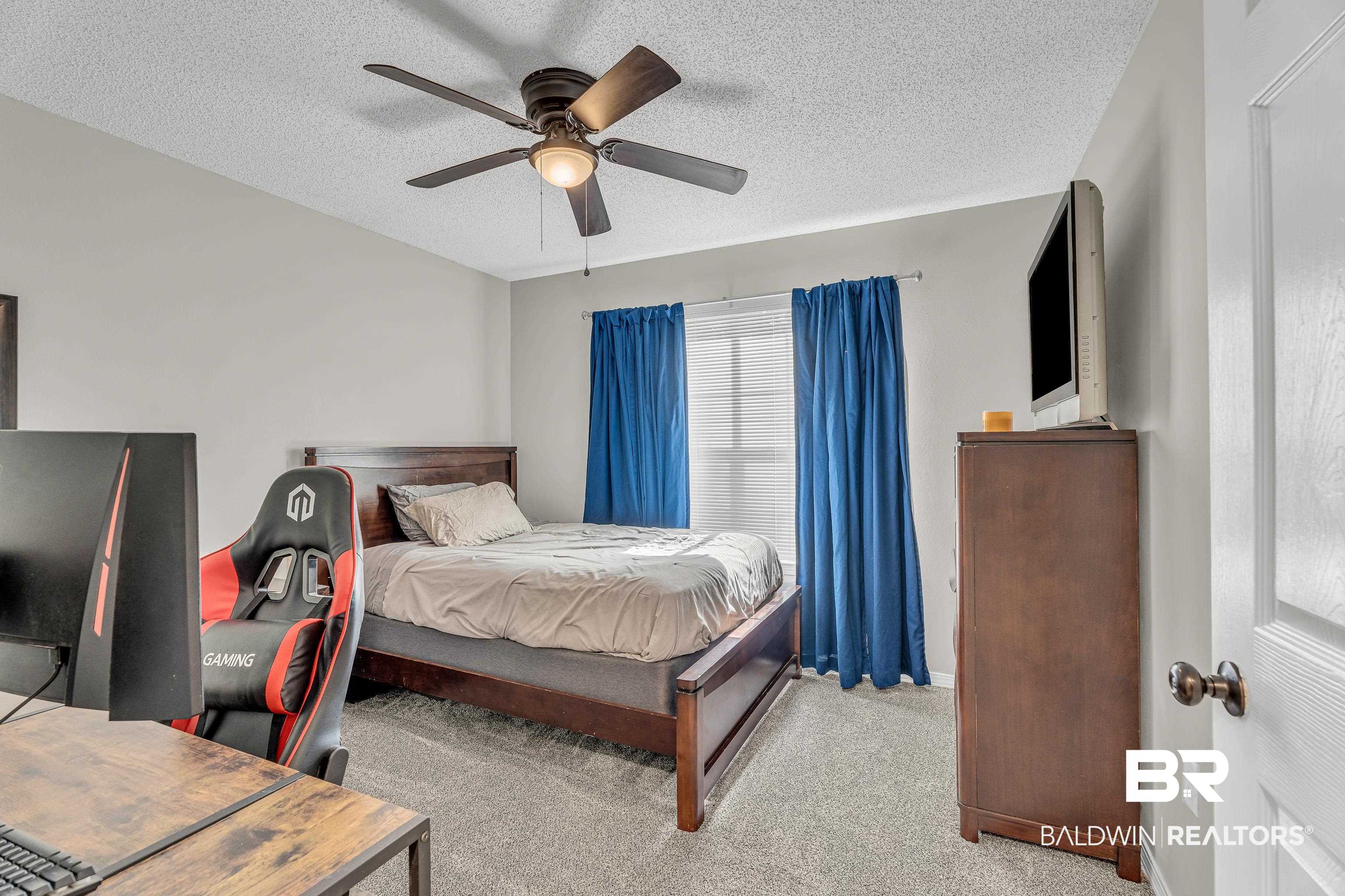 23214 Rochelle Loop Robertsdale, AL 36567 - Photo 27 of 27 Bedroom featuring light carpet, a textured ceiling, and ceiling fan