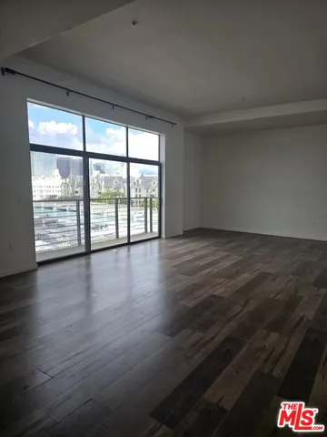 a kitchen with stainless steel appliances a refrigerator stove and sink