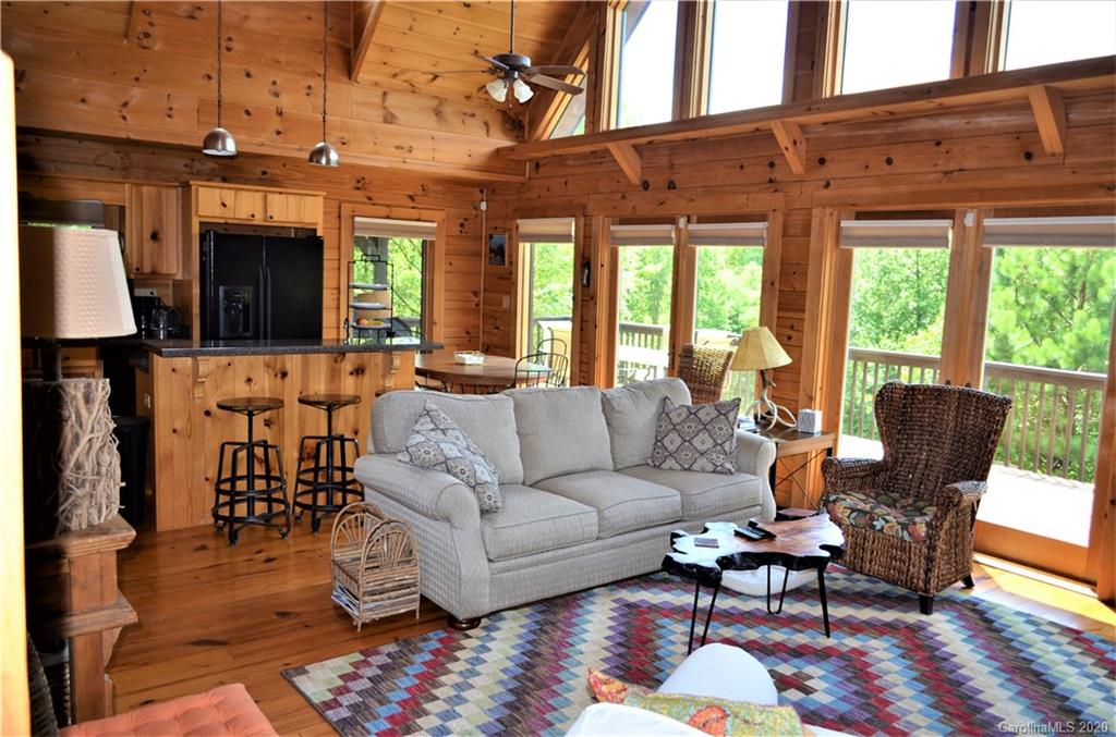 208 Loblolly Ln Mill Spring Mill Spring, NC 28756 - Photo 11 of 46 a living room with furniture a fireplace and a large window