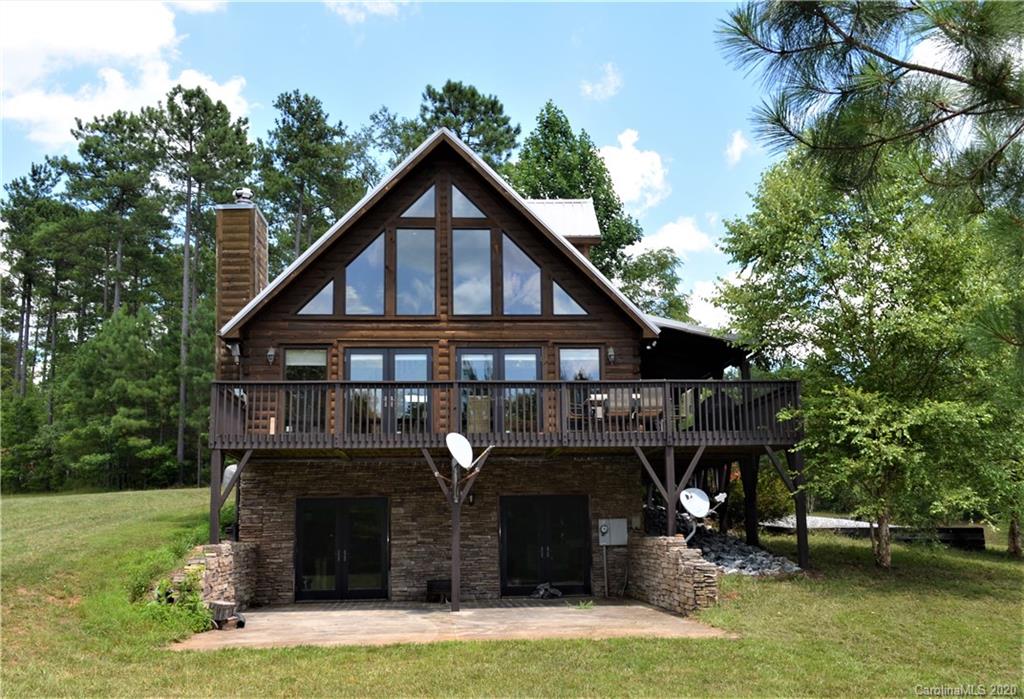208 Loblolly Ln Mill Spring Mill Spring, NC 28756 - Photo 3 of 46 a front view of a house with garden