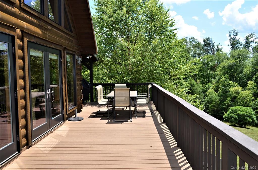 208 Loblolly Ln Mill Spring Mill Spring, NC 28756 - Photo 8 of 46 a balcony view with two chairs and a potted plant
