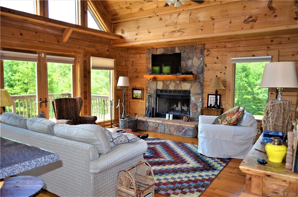 208 Loblolly Ln Mill Spring Mill Spring, NC 28756 - Photo 10 of 46 a living room with furniture and a fireplace