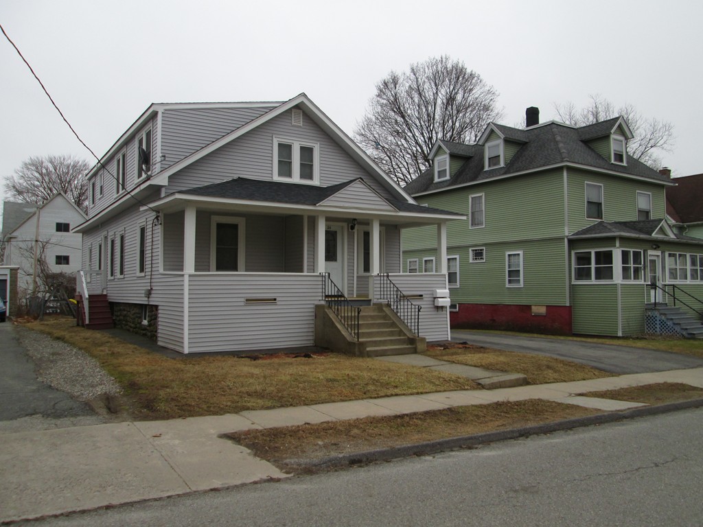 a view of a white house with large windows