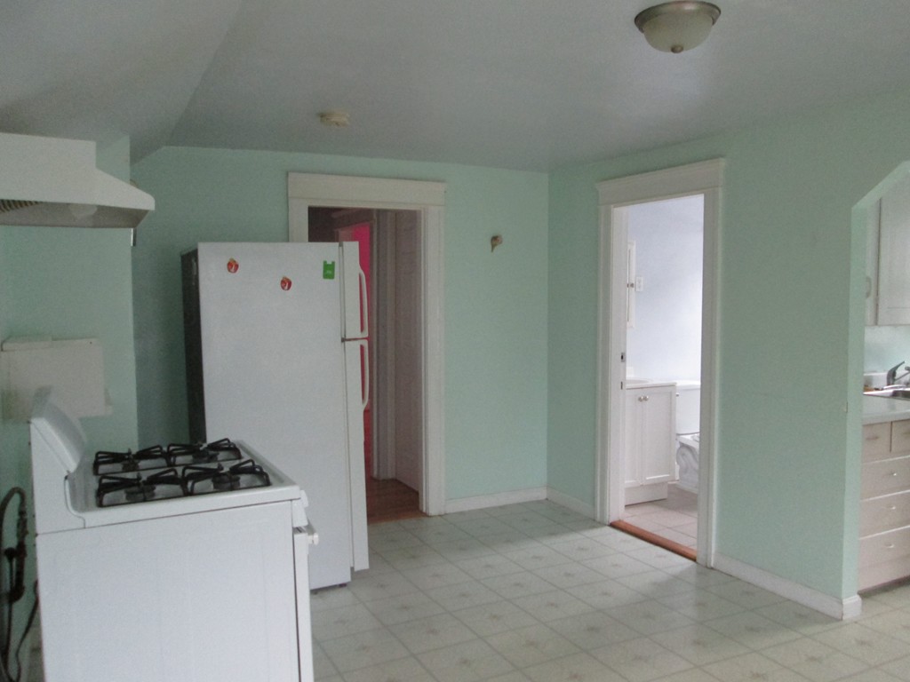 26 Sylvan Street Worcester, MA 01603 - Photo 15 of 27 a kitchen with a refrigerator and a stove