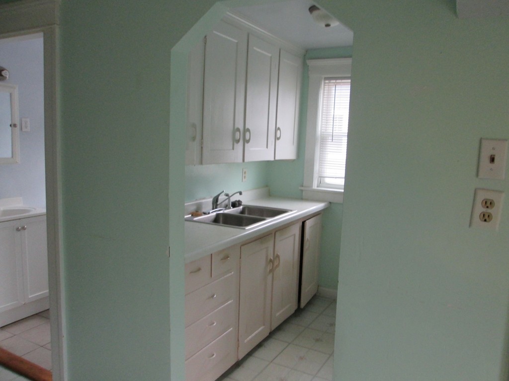 26 Sylvan Street Worcester, MA 01603 - Photo 16 of 27 a kitchen with a sink and cabinets