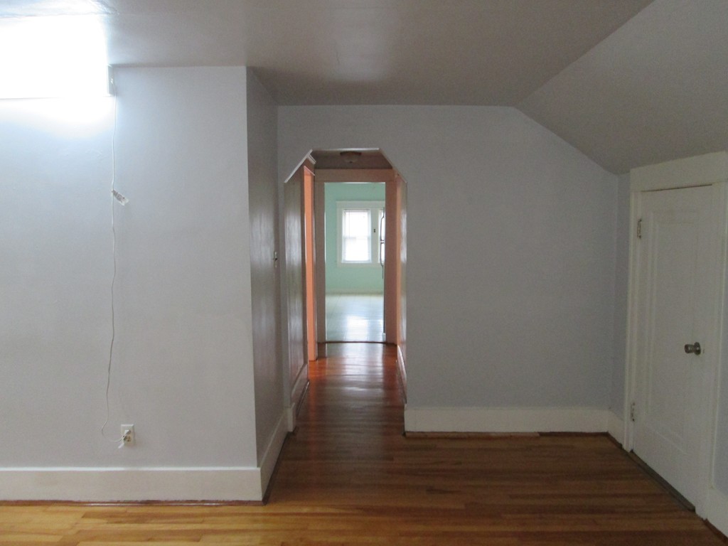 26 Sylvan Street Worcester, MA 01603 - Photo 20 of 27 a view of empty room with wooden floor and fan
