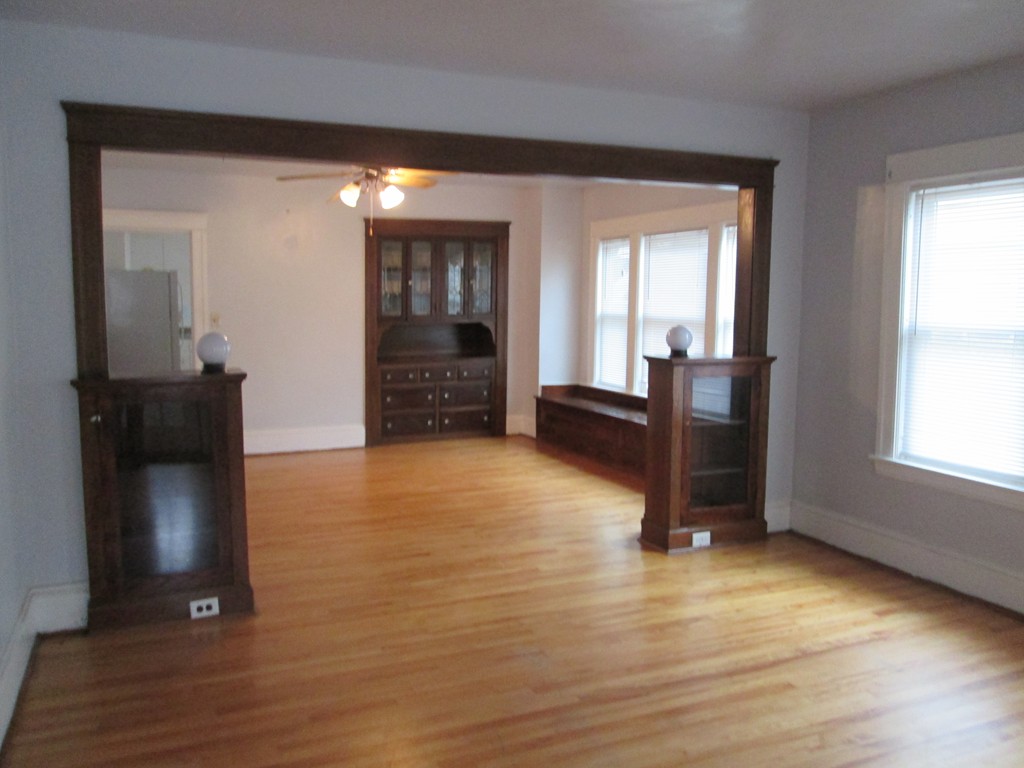 26 Sylvan Street Worcester, MA 01603 - Photo 5 of 27 wooden floor in an empty room with a window