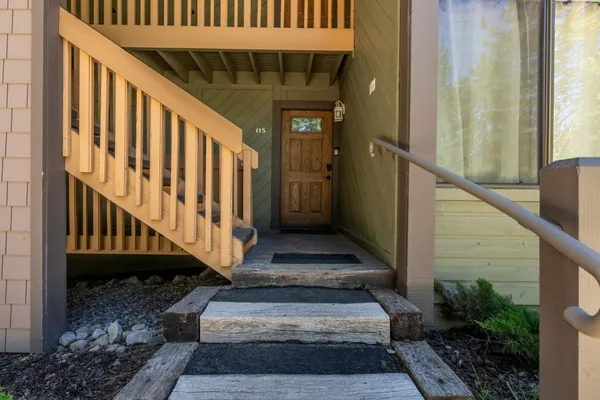 a view of a pathway of a house with wooden floor