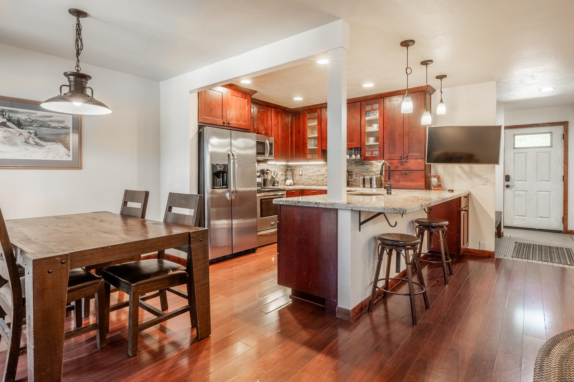 152 Viewpoint Road, Unit 115 Mammoth Lakes, CA 93546 - Photo 3 of 45 a view of a dining room with furniture window and wooden floor
