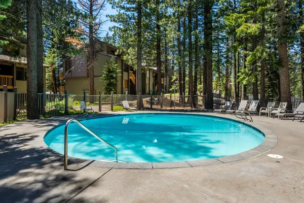 a view of a swimming pool with a patio