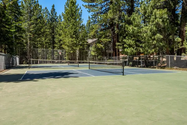 a view of a playground with basketball court