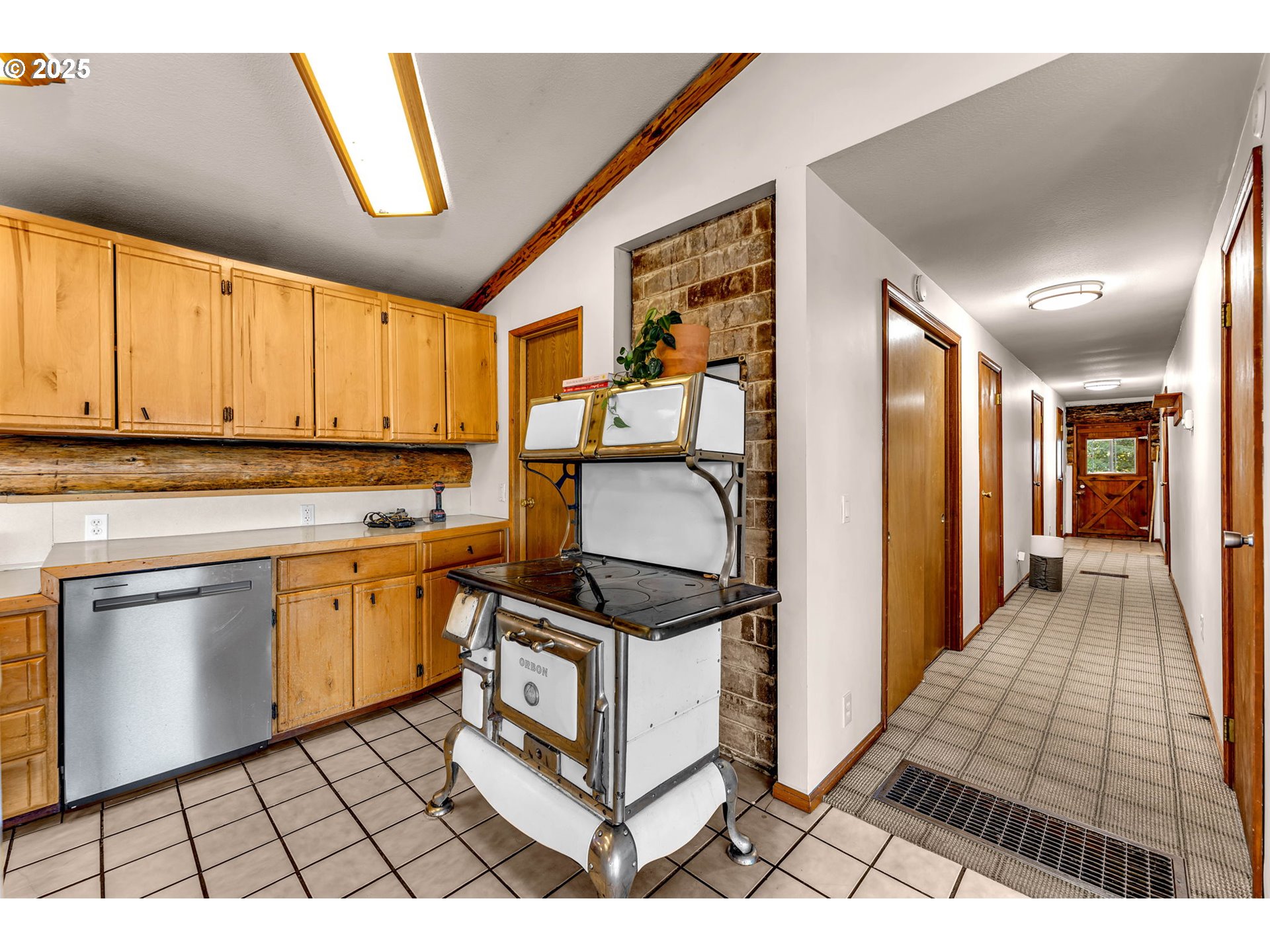 39904 Northeast Rotschy Road Yacolt, WA 98675 - Photo 26 of 48 a kitchen with stainless steel appliances granite countertop a stove a sink and a microwave