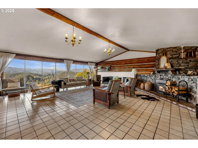 a living room with lots of furniture and a rug