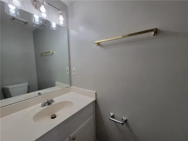 a bathroom with a sink and shower