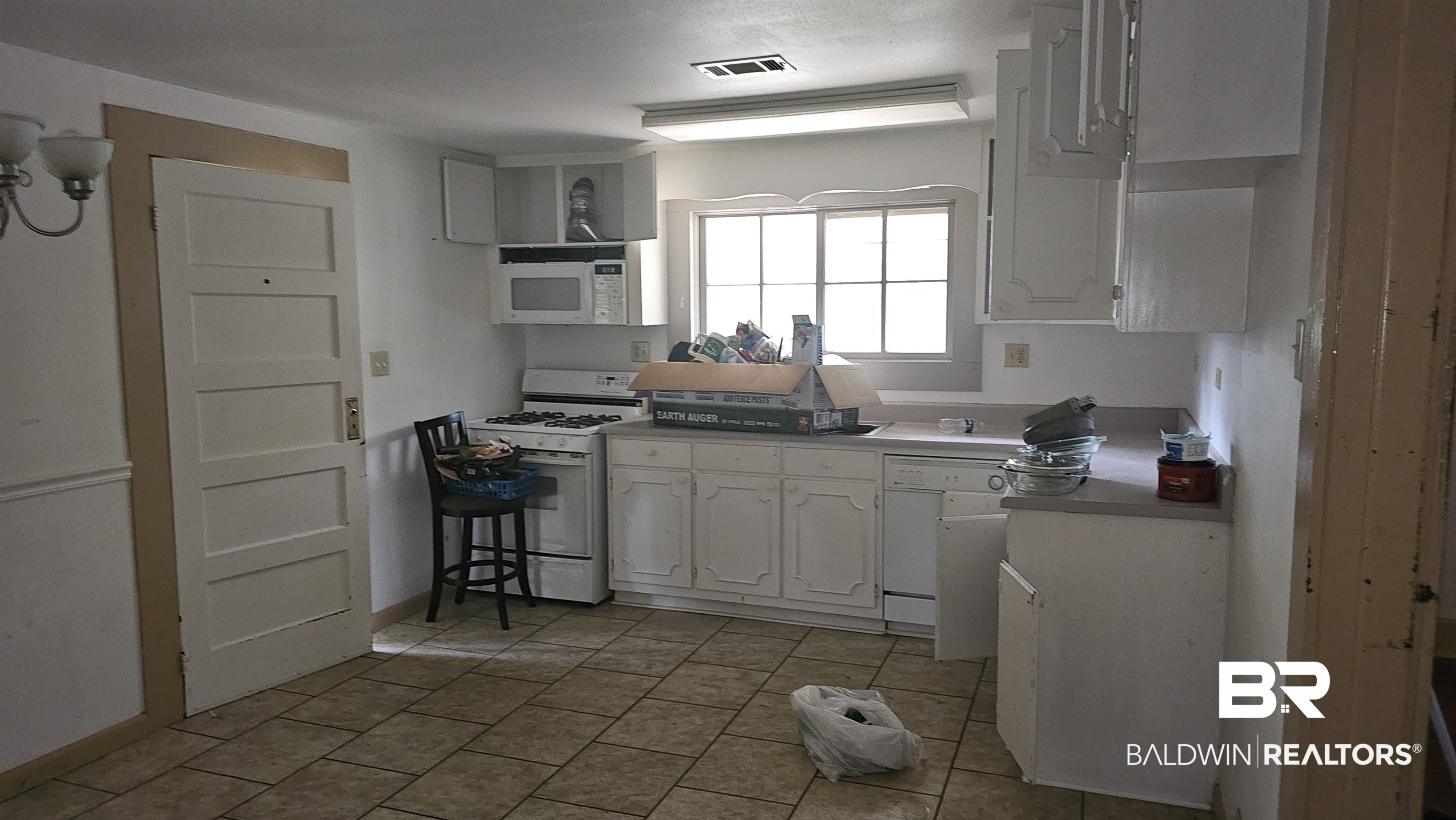 307 Scott Street Brewton, AL 36426 - Photo 11 of 19 Kitchen featuring white appliances and white cabinets