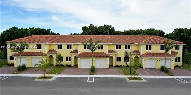 a front view of a residential houses with street