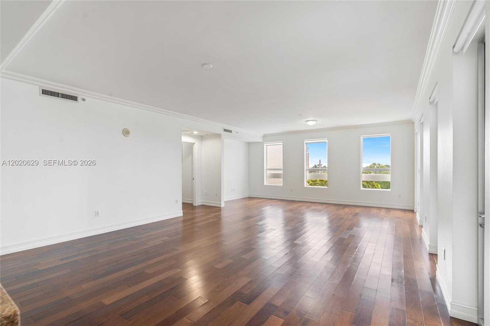 455 East Palmetto Park Road, Unit 4 Boca Raton, FL 33432 - Photo 3 of 30 a view of an empty room with wooden floor