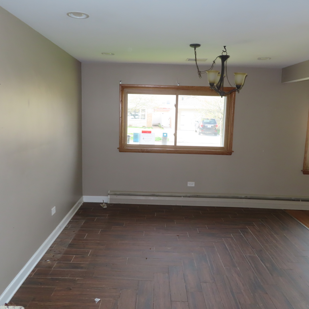8316 Coral Drive Norridge, IL 60706 - Photo 16 of 42 wooden floor and window in an empty room