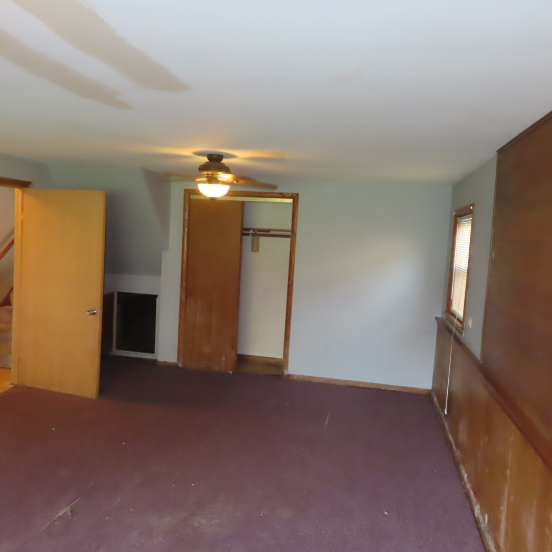 8316 Coral Drive Norridge, IL 60706 - Photo 23 of 42 a view of an empty room with a fireplace
